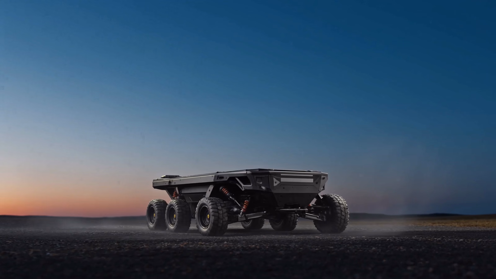 At dusk, the AAMS-X1 aerial platform descends and settles onto the deck of a waiting AGMS-X1 ground vehicle; both light signatures pulse in sync.